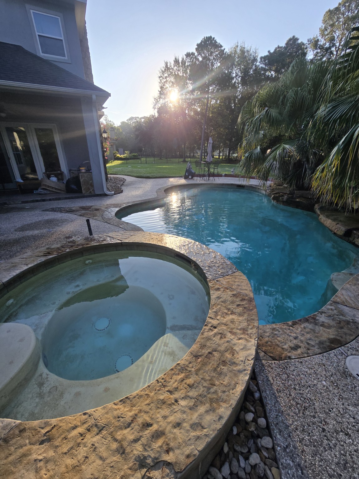 Residential swimming pool serviced by Aqua Heart Pools in the North Houston area
